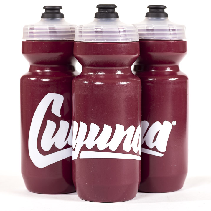 Purist water bottle in Cuyuna Ranger Red color (Dark Maroon) Official Cuyuna logo in white across the water bottle. Clear top on water bottle.