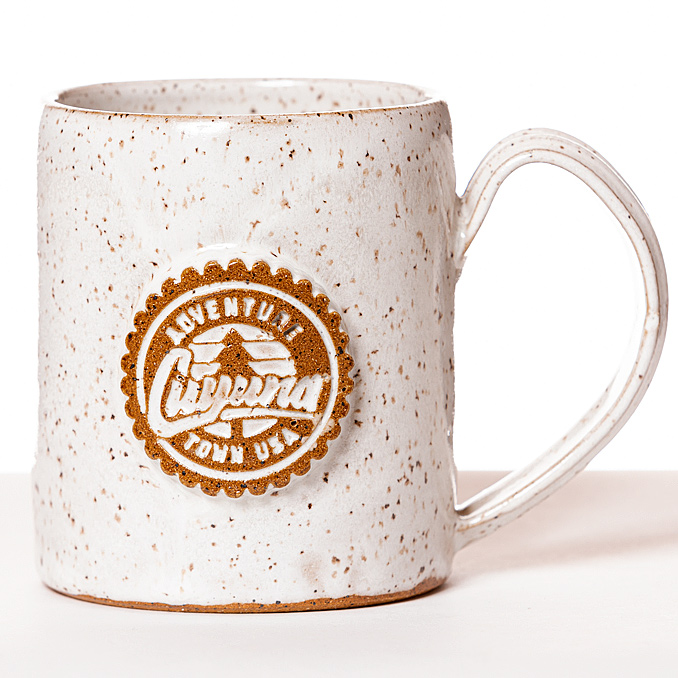 Cuyuna ceramic coffee mug. Hand-tossed by local artisan Gin Pottery. White glase with Cuyuna Adventure Town USA® compass rose seal. Authenticity guaranteed.